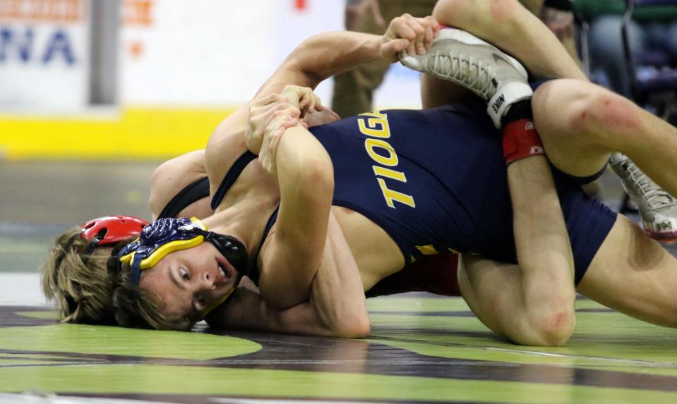 Tioga's Gianni Silvestri, front, was a 4-2 overtime winner over Chenango Valley's Trevor Cortright in the Division II 126-pound final at the Section 4 wrestling championships Feb. 11, 2023 at Visions Veterans Memorial Arena in Binghamton.