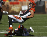 <p>Cincinnati Bengals tight end C.J. Uzomah (87) is tackled by Cleveland Browns defensive back Jason McCourty (30) in the second half of an NFL football game, Sunday, Oct. 1, 2017, in Cleveland. (AP Photo/Ron Schwane) </p>