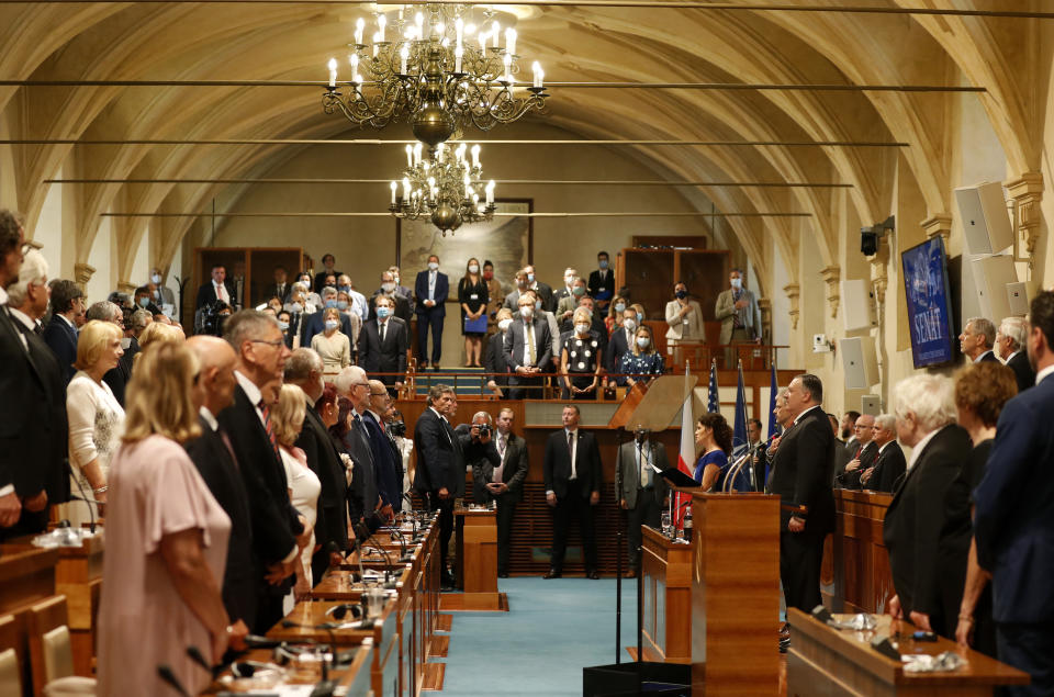 U.S. Secretary of State Mike Pompeo, right behind podium, attends a meeting of the senate in Prague, Czech Republic, Wednesday, Aug. 12, 2020. U.S. Secretary of State Mike Pompeo is in Czech Republic at the start of a four-nation tour of Europe. Slovenia, Austria and Poland are the other stations of the trip. (AP Photo/Petr David Josek, Pool)