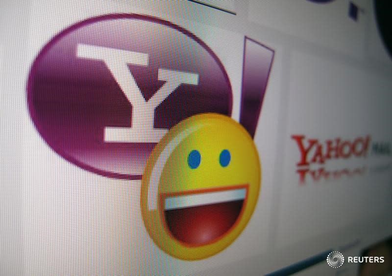 A Yahoo logo is displayed on a monitor in this photo illustration in Encinitas, California, April 16, 2013. REUTERS/Mike Blake/File Photo