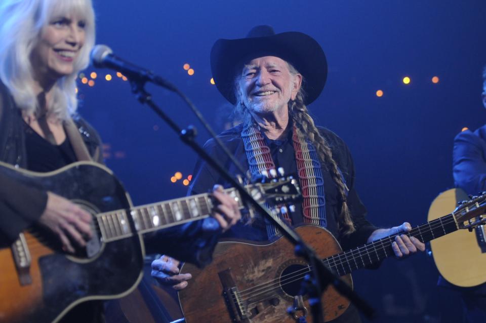 Emmylou Harris, left, performs with Willie Nelson during Austin City Limits Hall of Fame on Saturday night April 26, 2014. Nelson, who will celebrate his 81st birthday next week by receiving his fifth-degree black belt in martial arts, was the first Austin City Limits performer in 1974 on what is now the longest-running television music program in the U.S. (AP Photo/Courtesy of KLRU, Scott Newton)