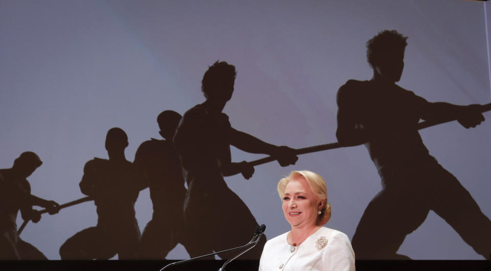 FILE - In this Saturday, Aug. 24, 2019, file picture Romanian Prime Minister Viorica Dancila smiles during a congress of the ruling Social Democratic Party (PSD) that officially designated her as the party's candidate for president of Romania in the presidential elections, in Bucharest, Romania. Romania’s presidential election scheduled for Nov. 10, has been overshadowed by the recent political crisis which led to the fall of the Social Democratic government.(AP Photo/Vadim Ghirda, File)
