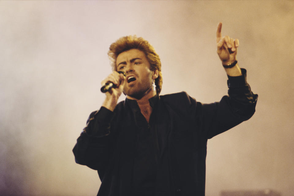 English singer, songwriter and musician, George Michael (1963-2016) performs live on stage at an Aids awareness charity concert at Wembley Arena in London in April 1987. (Photo by Michael Putland/Getty Images)