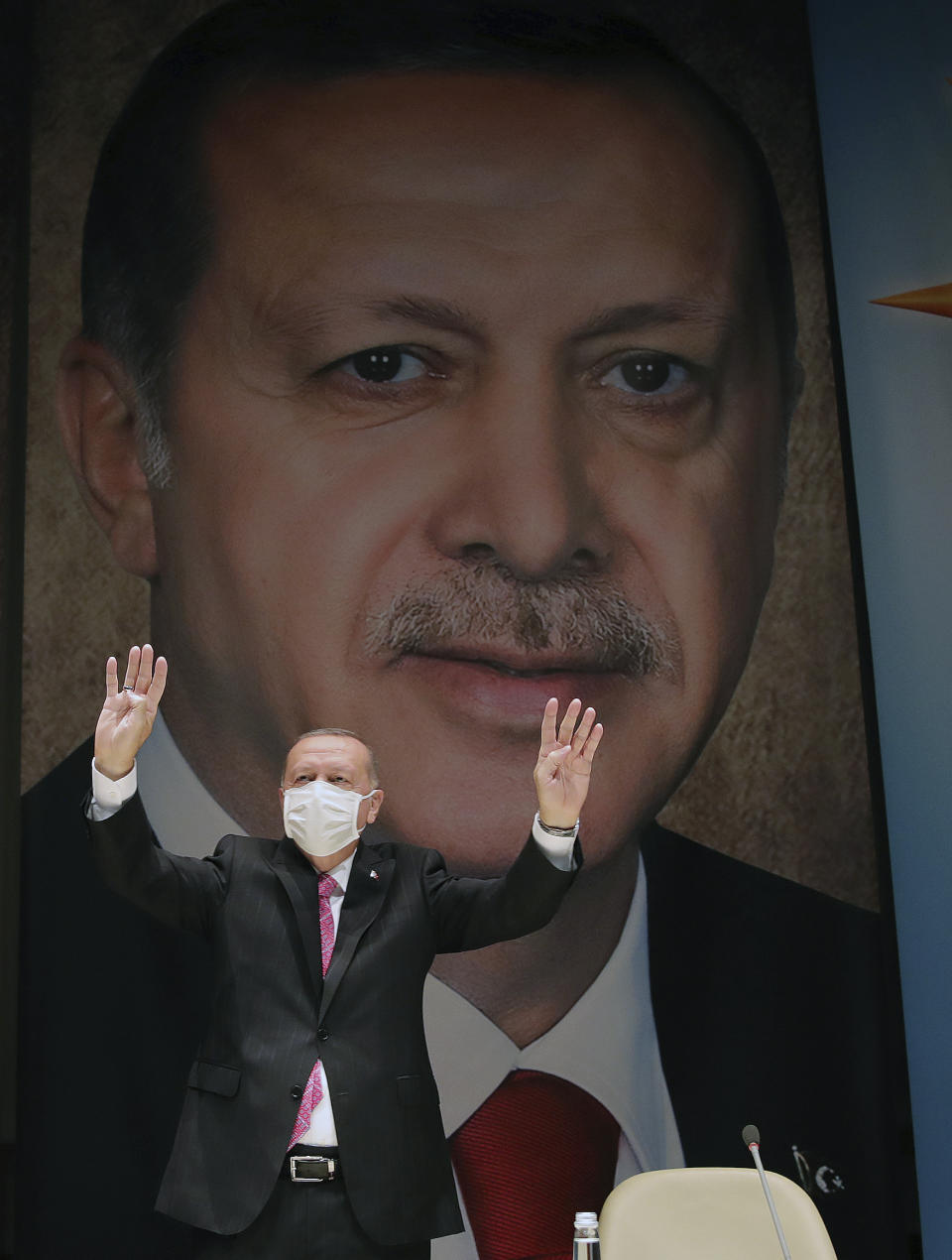 Turkey's President Recep Tayyip Erdogan gestures as he addresses his party members, in Ankara, Turkey, Thursday, Aug. 13, 2020. Greece’s prime minister has warmly thanked France for its decision to boost its military presence in the eastern Mediterranean, where Greek and Turkish warships are closely shadowing each other over a Turkish energy exploration bid in waters Athens claims as its own. (Turkish Presidency via AP, Pool)
