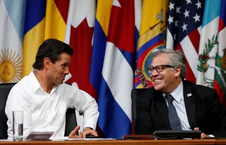 Mexico's President Enrique Pena Nieto smiles next to Organization of American States (OAS) Secretary General Luis Almagro during the opening ceremony of OAS 47th General Assembly in Cancun, Mexico Mexico June 19, 2017. REUTERS/Carlos Jasso