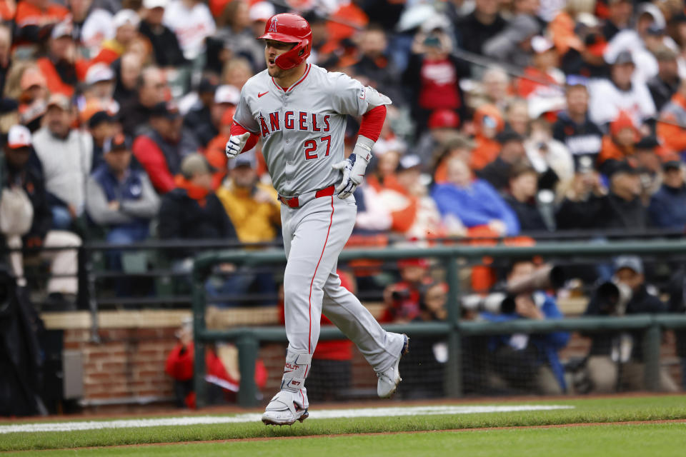 Los Angeles Angels' Mike Trout (27) runs towards home plate after hitting a home run during the first inning of a baseball game against the Baltimore Orioles, Thursday, March 28, 2024, in Baltimore. (AP Photo/Julia Nikhinson)