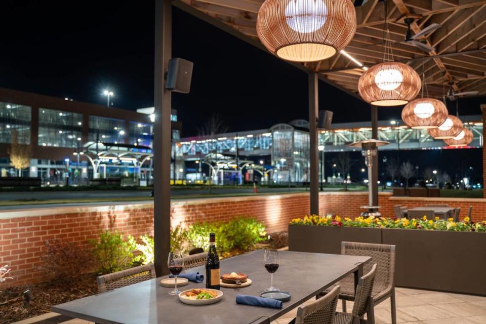 The patio at Golden Owl Tavern is heated with propane heaters and overlooks the LYNX Blue Line’s University City Blvd Station. The restaurant’s side patio (not shown) has fire pits with chairs surrounding.