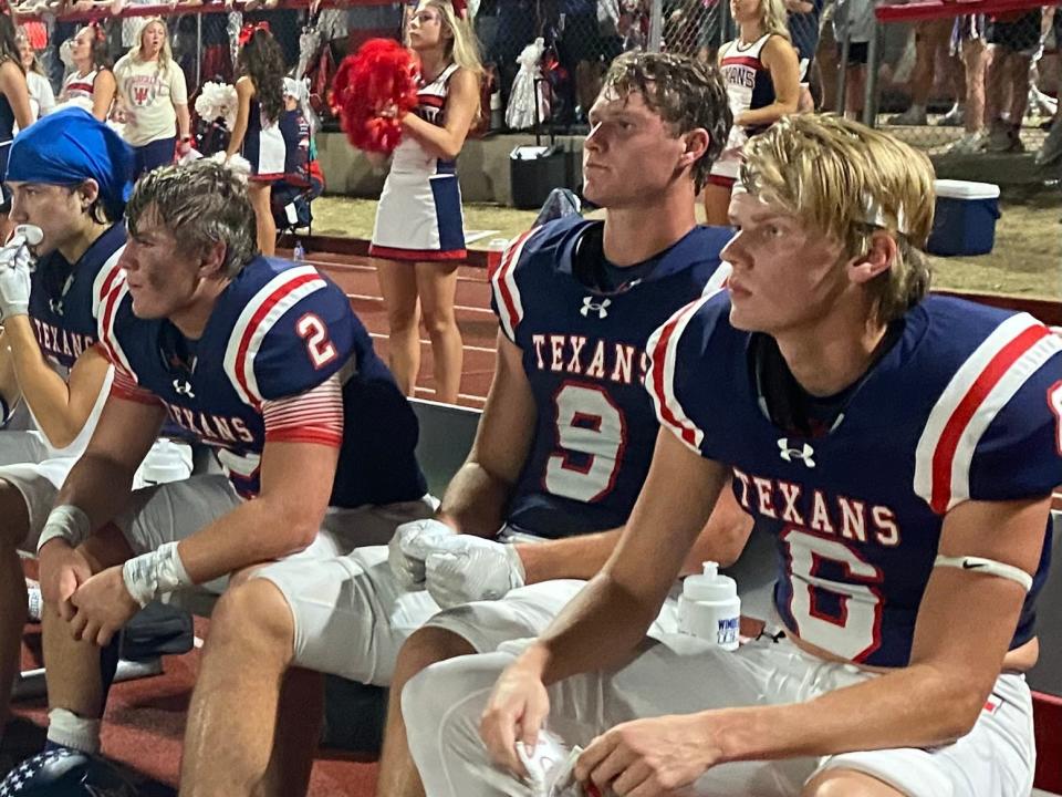 Wimberley quarterback Cody Stoever (2), sitting with receivers Noah Birdsong (9) and Wynston Burtschell (6), accounted for all six touchdowns in Friday's 41-20 victory over Lampasas. The Texans improved to 5-0.
