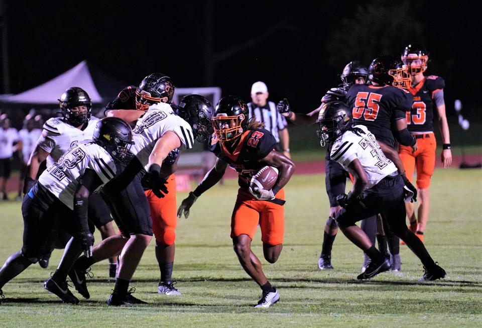 Cocoa running back Latrison Lane scores on a 14-yard touchdown in the second quarter against Treasure Coast on Friday, Sept. 29, 2023 in Cocoa. The Tigers won 38-0.