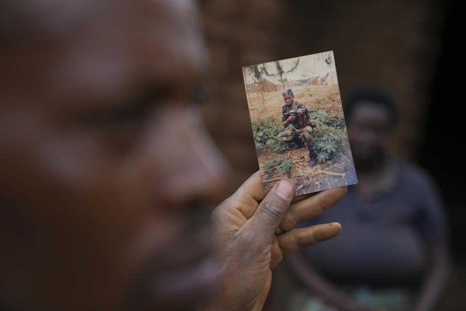 Patrick Hakizimana, a Hutu peasant who was jailed from 1996 to 2007 for his alleged role in the genocide as an army corporal, shows a photo during his time as a soldier in Gahanga the outskirts of Kigali, Rwanda, Tuesday, April 4, 2024. The country will commemorate on April 7, 2024 the 30th anniversary of the genocide when ethnic Hutu extremists killed neighbours, friends and family during a three-month rampage of violence aimed at ethnic Tutsis and some moderate Hutus, leaving a death toll that Rwanda puts at 1,000,050. (AP Photo/Brian Inganga)