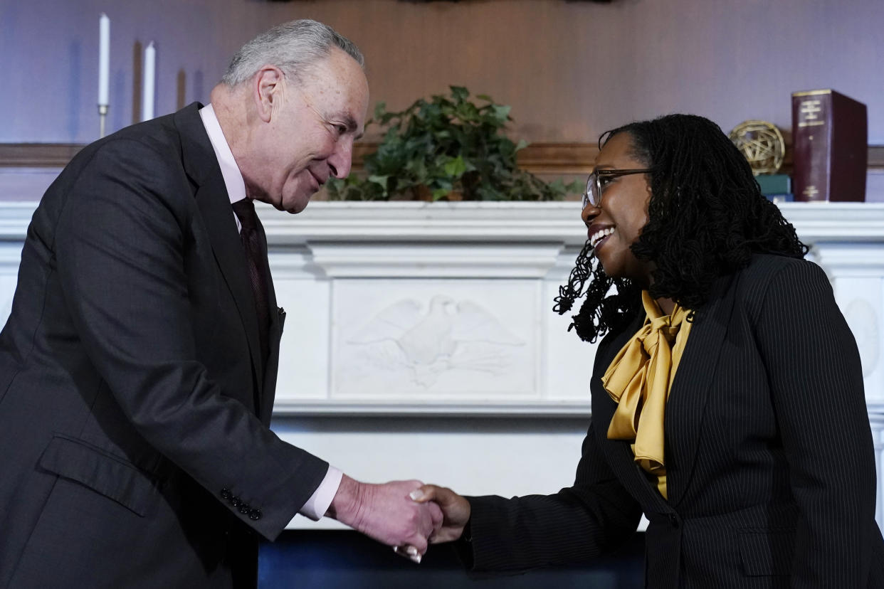 Senate Majority Leader Chuck Schumer of N.Y., left, shakes hands with Supreme Court nominee Ketanji Brown Jackson, right, at the beginning of their meeting on Capitol Hill in Washington, Wednesday, March 2, 2022. (AP Photo/Susan Walsh)