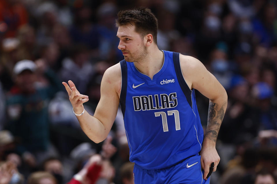 Dallas Mavericks guard Luka Doncic (77) celebrates his three-point basket during the first half of an NBA basketball game against the Phoenix Suns, Thursday, Jan. 20, 2022, in Dallas. (AP Photo/Brandon Wade)