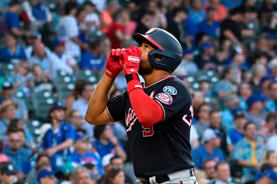 Washington Nationals third baseman Jeimer Candelario (9) points after he hits a two-run home run against the Chicago Cubs during the first inning at Wrigley Field. Matt Marton/USA TODAY Sports