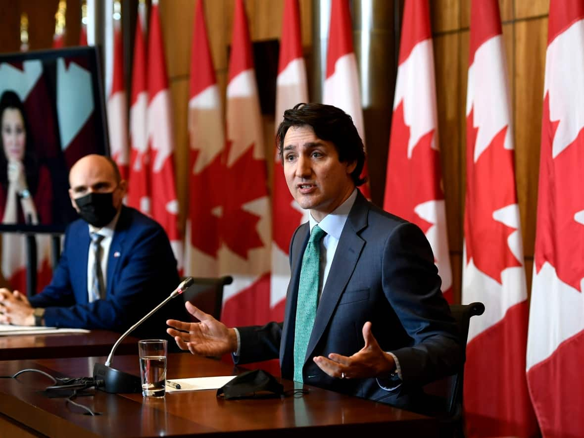 Prime Minister Justin Trudeau speaks alongside Minister of Health Minister Jean-Yves Duclos. The federal government will offer the provinces a 10-year health-care funding deal, CBC News has learned. (Justin Tang/The Canadian Press - image credit)