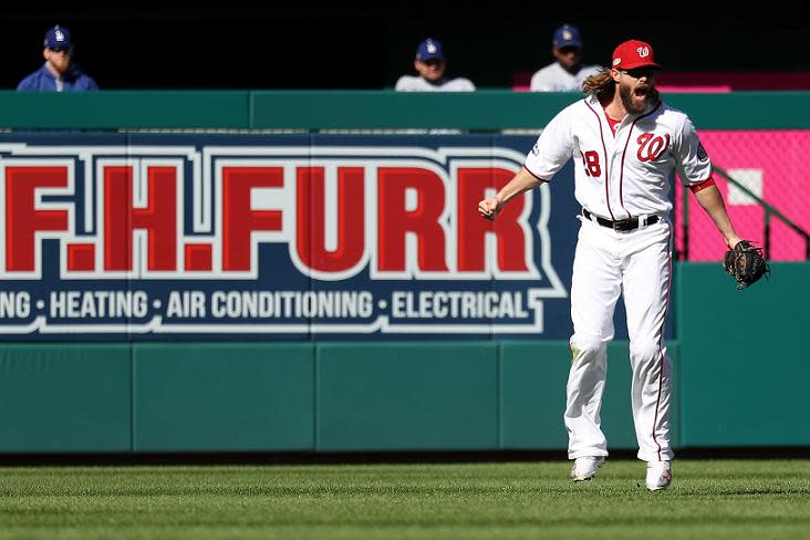 Jayson Werth celebrates after making a clutch diving catch to end the Dodgers fifth-inning rally. (Getty Images)