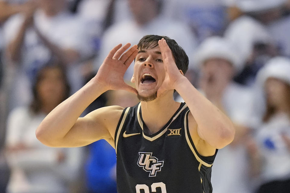 Central Florida guard Nils Machowski (22) shouts to teammates during the first half of an NCAA college basketball game against BYU Tuesday, Feb. 13, 2024, in Provo, Utah. (AP Photo/Rick Bowmer)