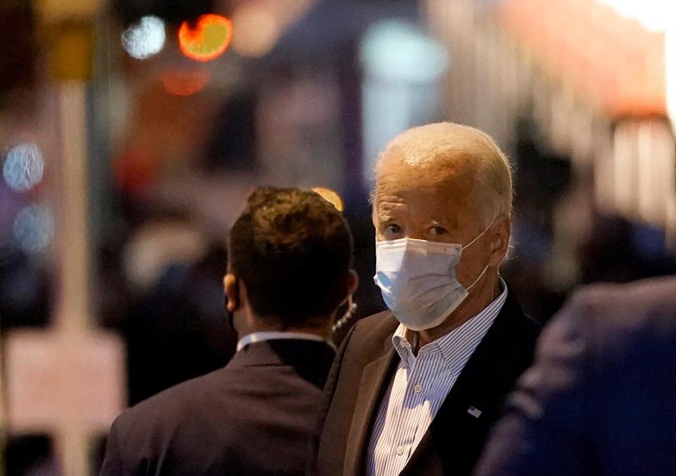 Democratic presidential nominee Joe Biden walks out of The Queen theater in Wilmington, Delaware on Nov. 5, 2020.