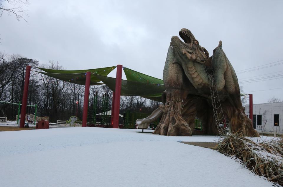 Snow covers the ground at the Loch Neuse Dragon Playground in downtown Kinston Thursday morning, Jan. 28.