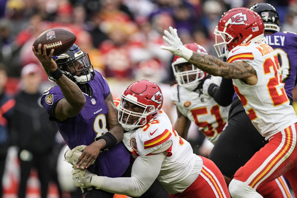 Kansas City Chiefs defensive tackle Chris Jones (95) sacks Baltimore Ravens quarterback Lamar Jackson (8) during the first half of an AFC Championship NFL football game, Sunday, Jan. 28, 2024, in Baltimore. (AP Photo/Alex Brandon)