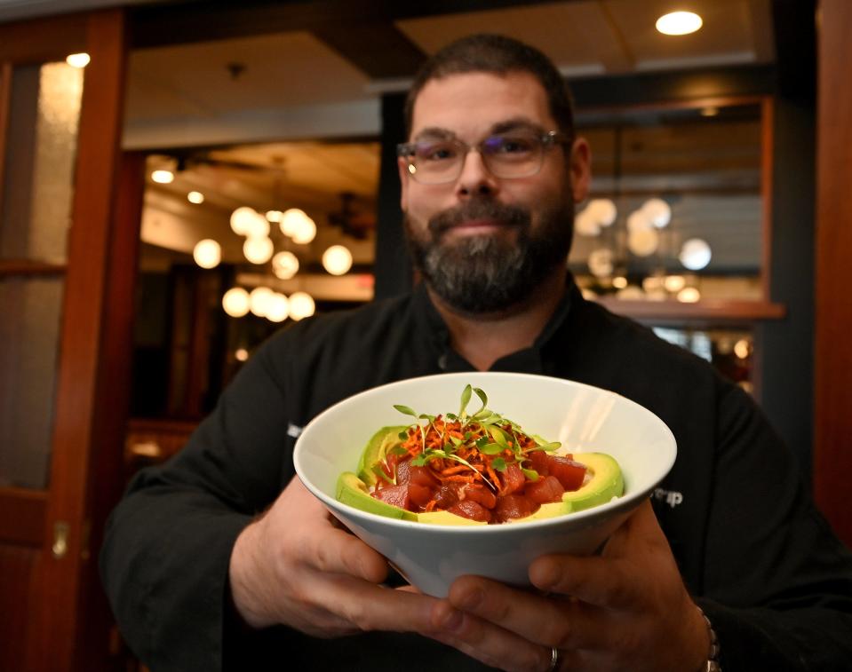 Mark Hawley, executive chef for Worcester Restauramt Group, with $10 Tuna Poke Bowl at The Sole Proprietor.