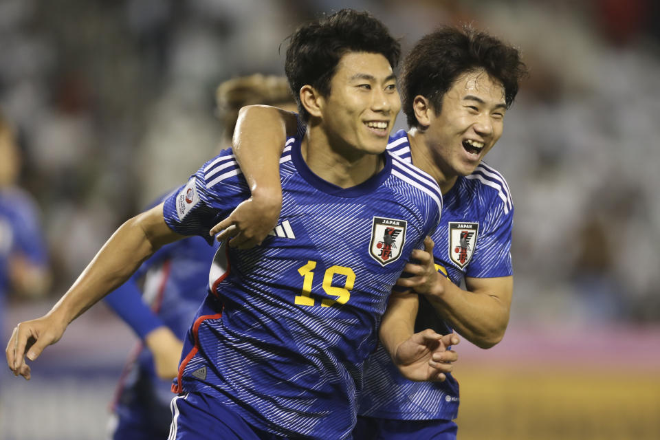 Japan's Moa Hosoya, left, celebrates after he scored during a U-23 Asian Cup semi-final match between Iraq and Japan in Doha, Qatar, on Monday, April 29, 2024. (AP Photo/Hussein Sayed)