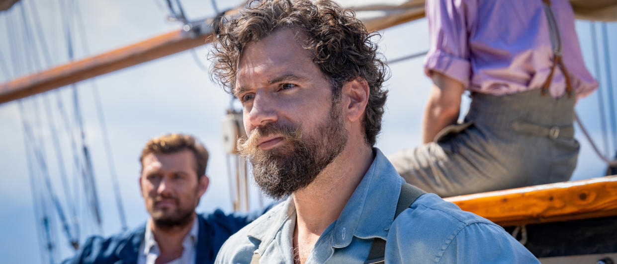  Henry Cavill looking rugged while he stands on a boat in The Ministry of Ungentlemanly Warfare. 