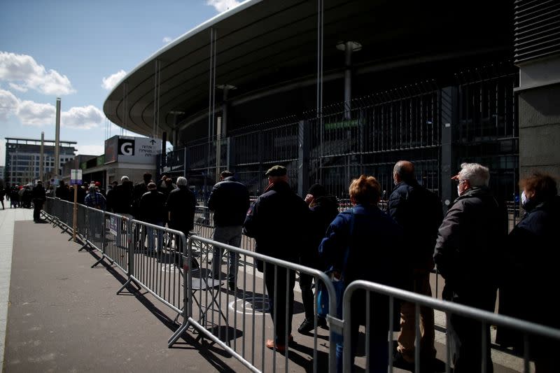 FILE PHOTO: Vaccinations begin at the Stade de France stadium opened as a mass vaccination center