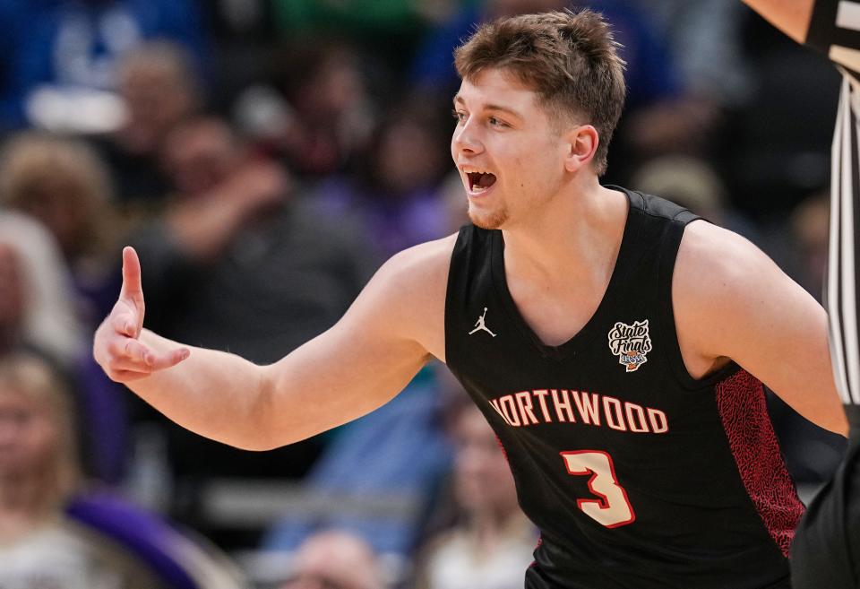 NorthWood Panthers Cade Brenner (3) celebrates scoring three points on Saturday, March 25, 2023 at Gainbridge Fieldhouse in Indianapolis. The NorthWood Panthers lead at the half against the Guerin Catholic Golden Eagles, 35-27 in the IHSAA Class 3A state finals championship. 