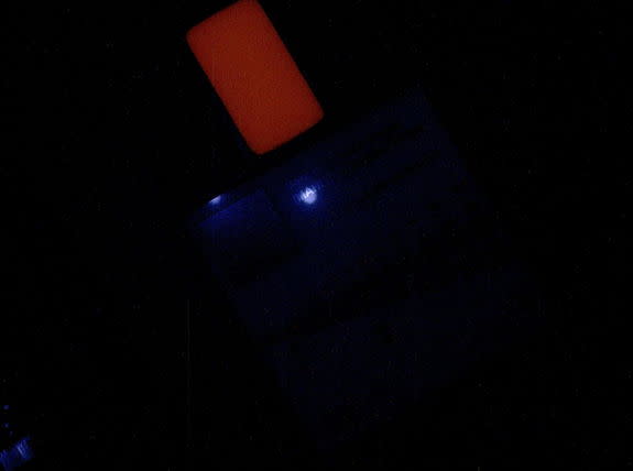 This image of a calibration target illuminated by ultraviolet LEDs (light emitting diodes) is part of the first set of nighttime images taken by the Mars Hand Lens Imager (MAHLI) camera at the end of the robotic arm of NASA's Mars rover Curiosi