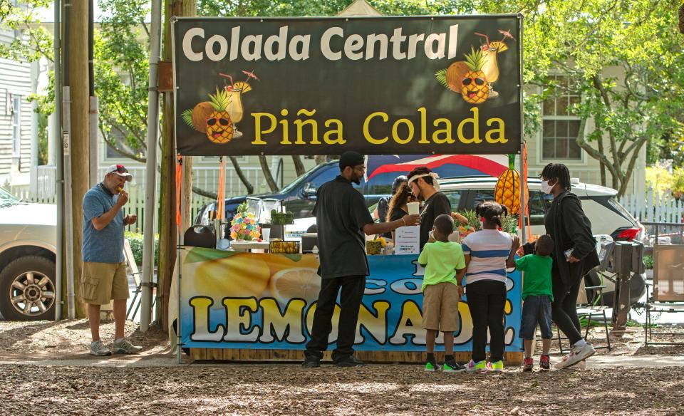 Visitors check out the vendors during the Gulf Coast Culture Fest at Seville Square in May 2021. The event returns Saturday.