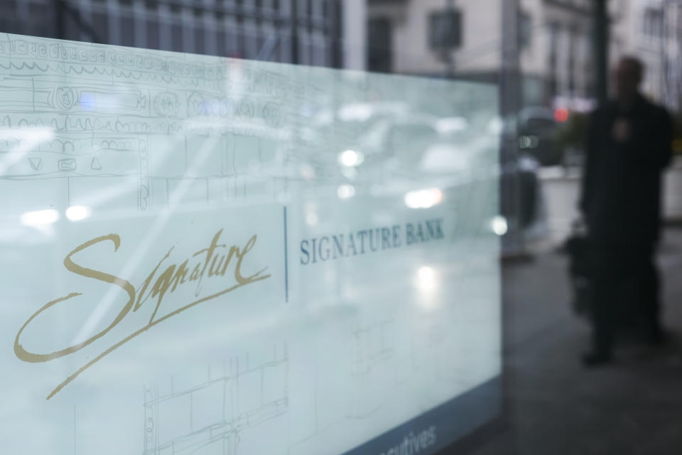 A sign is displayed at a branch of Signature Bank in New York, Monday, March 13, 2023. President Joe Biden is telling Americans that the nation's financial systems are sound. This comes after the swift and stunning collapse of two banks that prompted fears of a broader upheaval. (AP Photo/Seth Wenig)