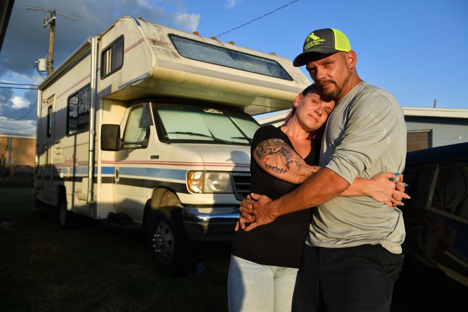 Jessica and Rusty Foltz have been staying in a borrowed 1994 Jamboree RV, parked next to her mother’s home in Port Charlotte. The home they were renting in South Sarasota County was flooded after Hurricane Ian.