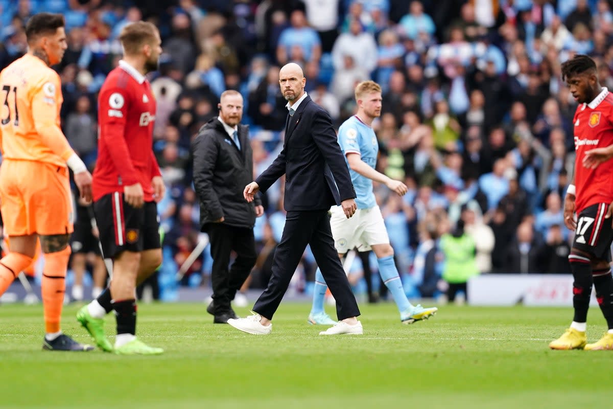 Erik ten Hag and his Manchester United players react following their derby thrashing (Martin Rickett/PA) (PA Wire)