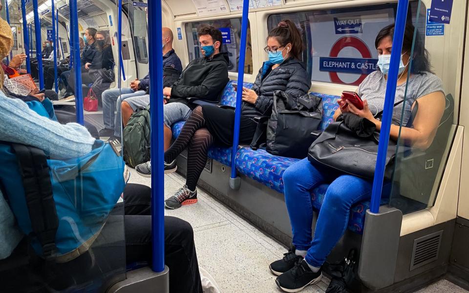 Commuters take the tube to work days after the Government changed its advice on going to the office - Aaron Chown/PA