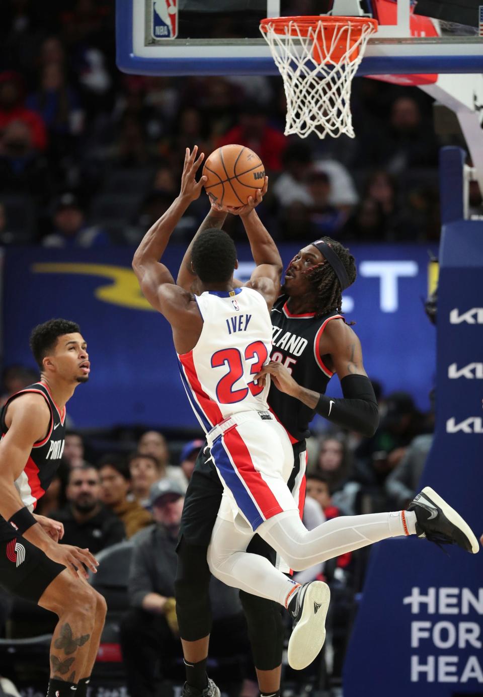 Detroit Pistons guard Jaden Ivey (23) drives against Portland Trail Blazers center Robert Williams III (35) during third-quarter action at Little Caesars Arena in Detroit on Wednesday, Nov. 1, 2023.