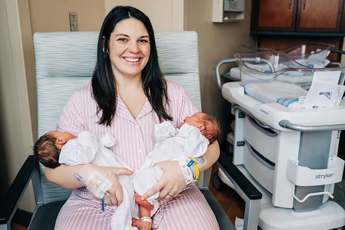 Kelsey Hatcher holds Roxi on the left and Rebel on the right (Andrea Mabry / The University of Alabama at Birmingham Hospital )