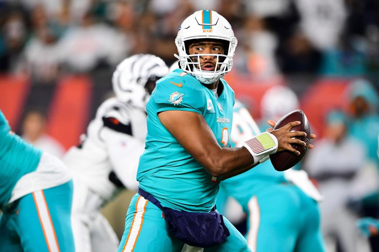 Mandatory Credit: Photo by Emilee Chinn/AP/Shutterstock (13437097dc) Miami Dolphins quarterback Tua Tagovailoa (1) drops back to pass during an NFL football game against the Cincinnati Bengals, in Cincinnati Dolphins Bengals Football, Cincinnati, United States - 29 Sep 2022