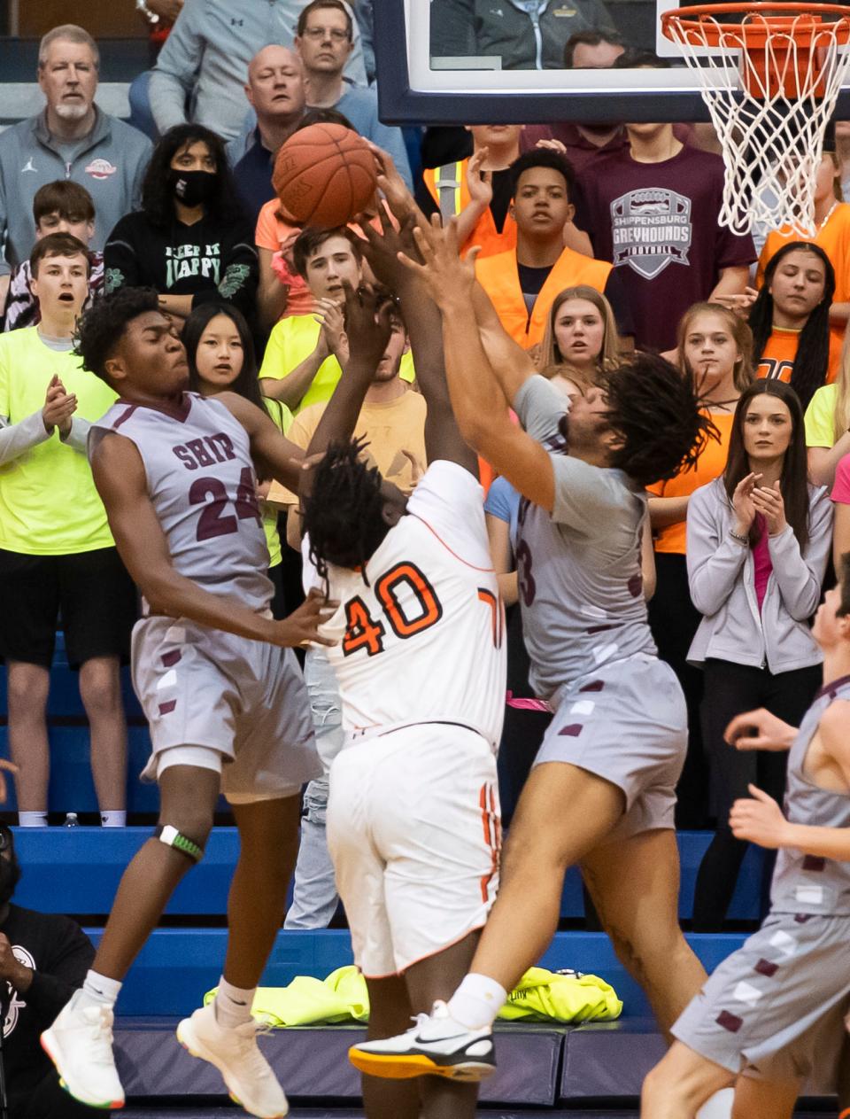 Shippensburg's Anthony Smith blocks a shot from Chester's Jerry Young (40) during the first quarter of a PIAA Class 5A quarterfinal game at Manheim Township High School, Tuesday, March 15, 2022. The Greyhounds fell, 65-59.