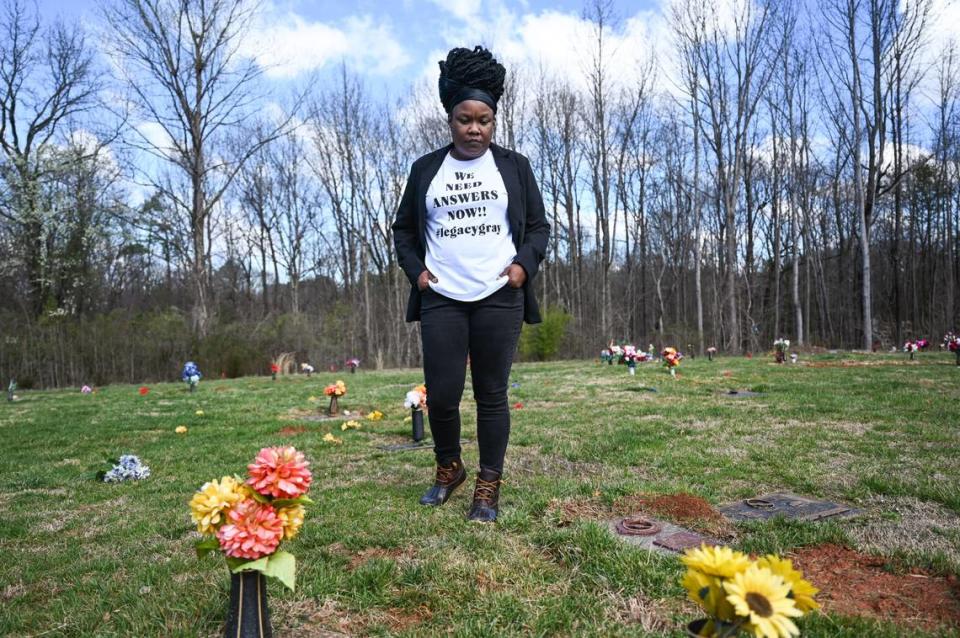 LaChunda Hunter stands in front of the plot at York Memorial Cemetery, in Charlotte, where a baby identified as hers was buried in 2022. The grave is unmarked because a mistake by a doctor at Novant Presbyterian Medical Center has left her struggling with uncertainty.