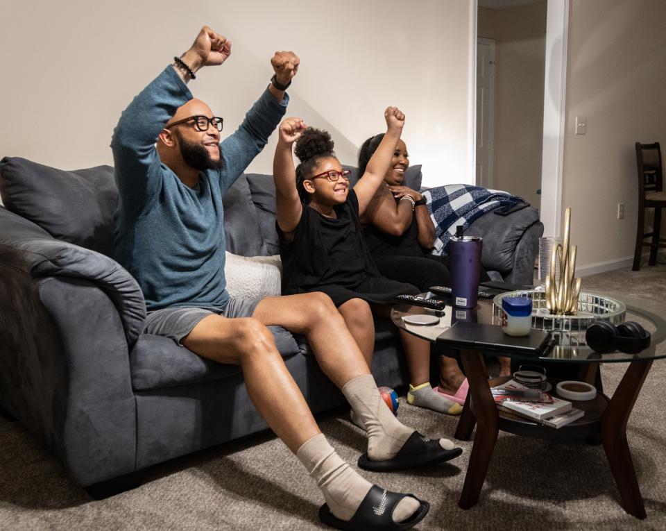 In their apartment in Fayetteville, James Ghee, his daughter, London, and fiancee Tiffany Owensby react as James' brother J. Harrison Ghee wins 2023 Tony Award for best actor in a musical. J. Harrison Ghee is one of the lead performers in "Some Like It Hot" on Broadway.