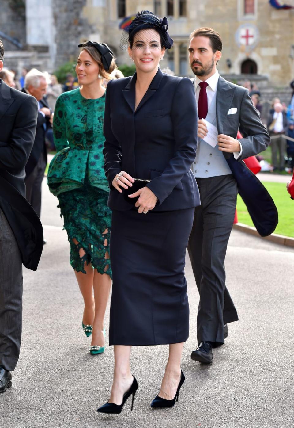 <p>Now, let's give it up for American royalty. Actress Liv Tyler and her partner Dave Gardner were some of the first guests to arrive. She wore a navy suit and a hat by Stephen Jones.</p>
