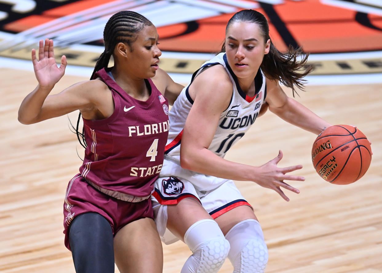Florida State guard Sara Bejedi defends UConn guard Nika Muhl during their game on Dec. 18, 2022, at the Mohegan Sun Arena in Uncasville, Connecticut. (Williams Paul/Icon Sportswire via Getty Images)
