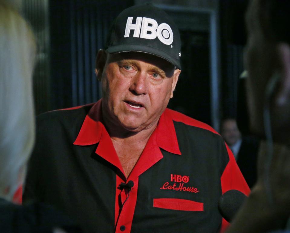 FILE - In this June 13, 2016, file photo, Dennis Hof, owner of the Moonlite BunnyRanch, a legal brothel near Carson City, Nevada, is pictured during an interview in Oklahoma City. County officials in Nevada have yanked a brothel license from the state's most famous pimp who has fashioned himself as a Donald Trump-style candidate for Nevada's legislature. Officials in Southern Nevada's Nye County on Tuesday said Dennis Hof had failed to apply for a renewal and pay fees for his Love Ranch brothel in Crystal, about an hour's drive northwest of Las Vegas. (AP Photo/Sue Ogrocki, File)