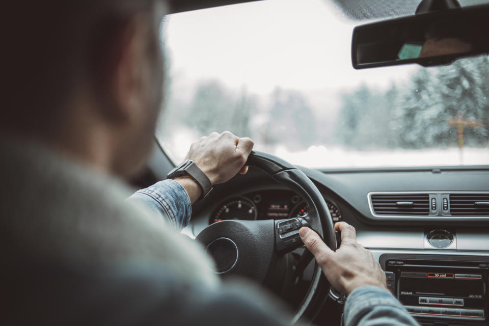 A man driving a car