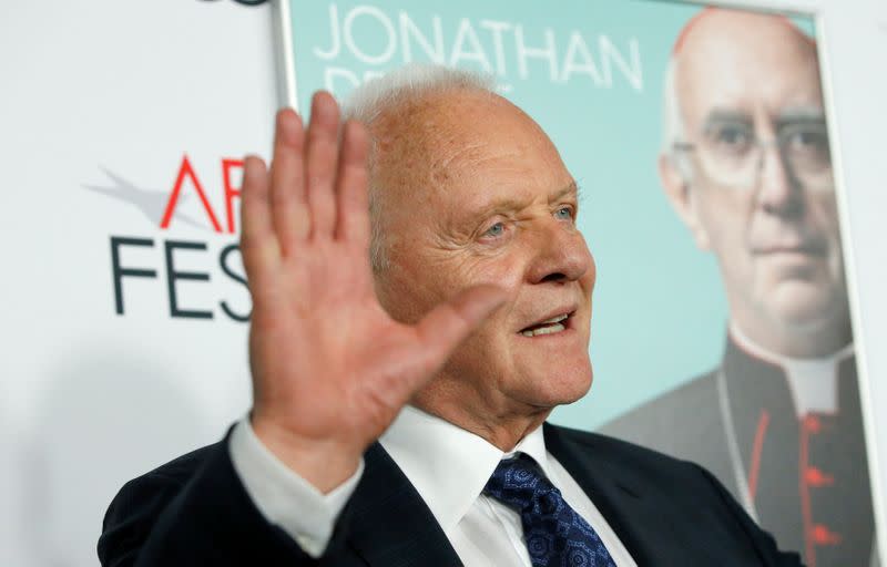 Cast member Hopkins waves at a premiere for the film "The Two Popes" during AFI Fest 2019 in Los Angeles