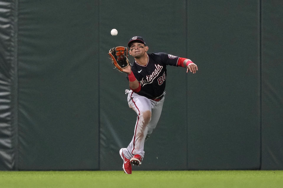 FILE - Washington Nationals center fielder Gerardo Parra makes the catch on a fly ball hit by San Francisco Giants' Donovan Solano during the sixth inning of a baseball game Friday, July 9, 2021, in San Francisco. On Monday, May 16, 2022, Parra announced on Instagram that he is retiring from baseball after 12 seasons in the major leagues and will become a special assistant to Washington Nationals general manager Mike Rizzo. (AP Photo/Tony Avelar, File)