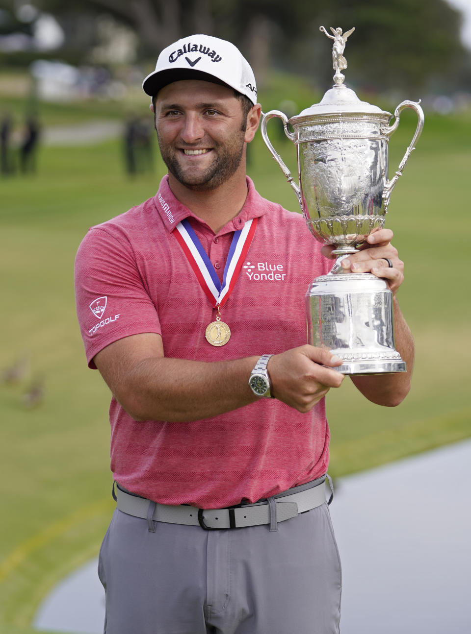 Jon Rahm, of Spain, holds the champions trophy for photographers after the final round of the U.S. Open Golf Championship, Sunday, June 20, 2021, at Torrey Pines Golf Course in San Diego. (AP Photo/Marcio Jose Sanchez)