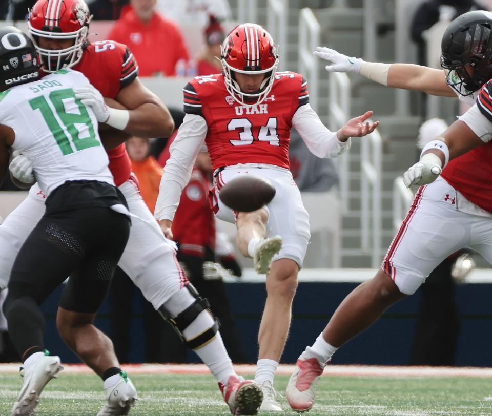 Utah Utes punter Jack Bouwmeester (34) putns against Oregon in Salt Lake City on Saturday, Oct. 28, 2023. Oregon won 35-6. | Jeffrey D. Allred, Deseret News