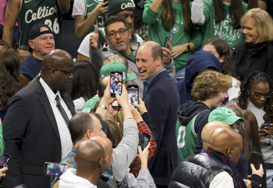 Britain's Prince William walks during halftime of an NBA basketball game between the Boston Celtics and the Miami Heat in downtown Boston, Wednesday, Nov. 30, 2022. (Brian Snyder/Pool Photo via AP)