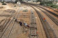 Labourers from the Pakistan Railways are seen working on railway tracks along City Station in Karachi, Pakistan September 24, 2018. REUTERS/Akhtar Soomro/Files